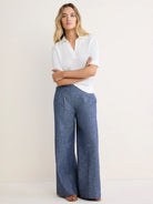 White short-sleeve mesh polo sweater with an open knit texture.