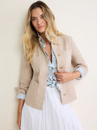 Beige cotton twill barn jacket with button front and two chest patch pockets.