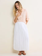 Pale peach crinkled cotton shirt with rolled 3/4 sleeves and button front.