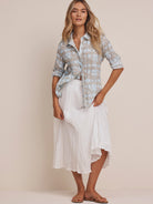 Light blue and tan shibori cotton shirt with a crinkled texture and button front.