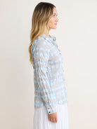 Light gray crinkled cotton shirt with light blue shibori patterns. Button-up, long sleeves.