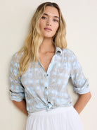 Crinkled grey-taupe cotton shirt with abstract light blue and white pattern, button front, and rolled sleeves.