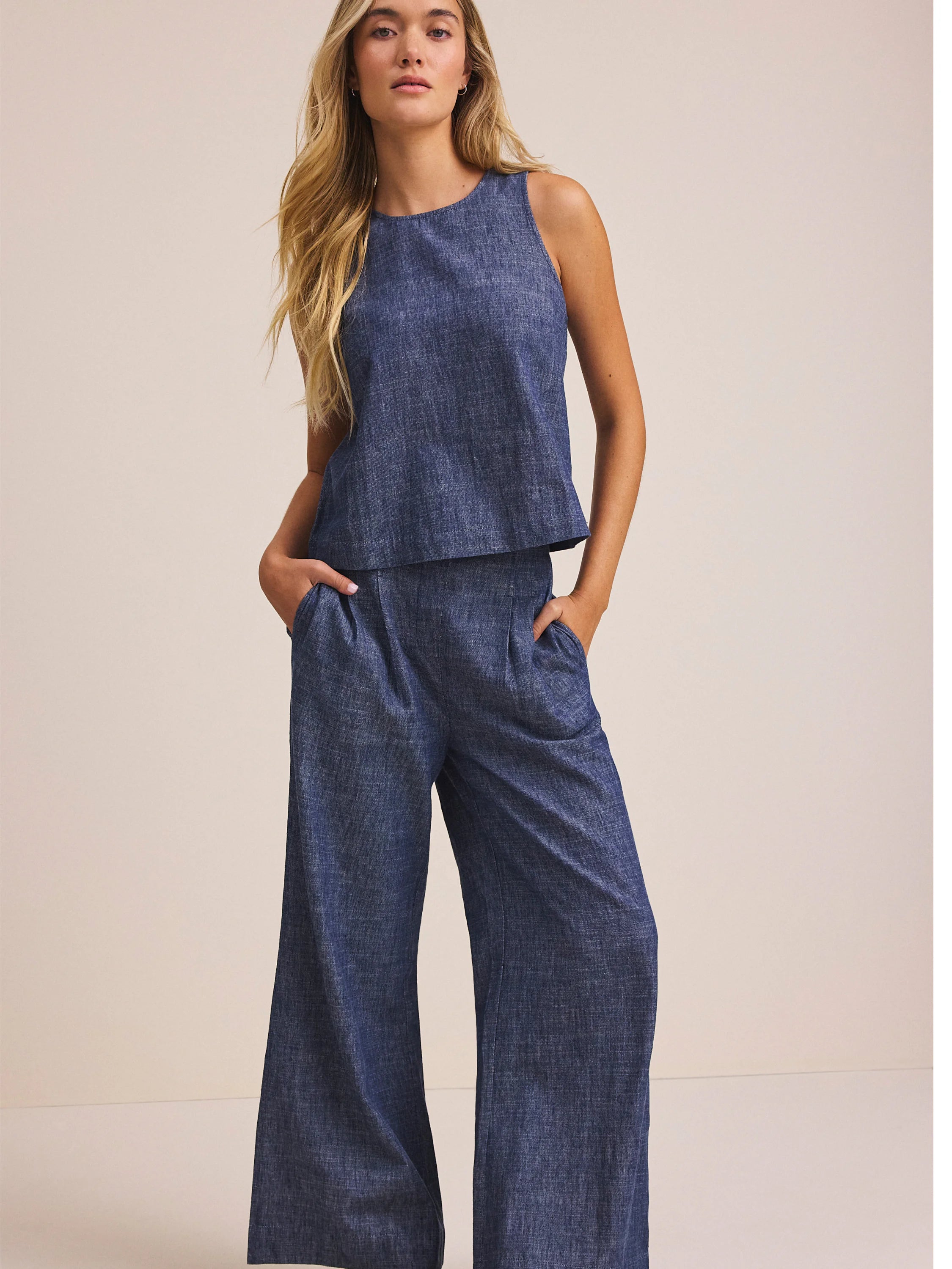 Chambray blue Stevie tank, sleeveless with a round neck. Worn as a set with matching wide-leg pants.