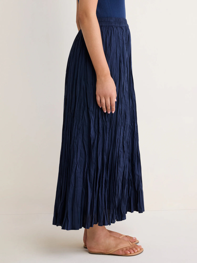 Navy blue, long, flowy crinkle skirt with a gathered elastic waist.