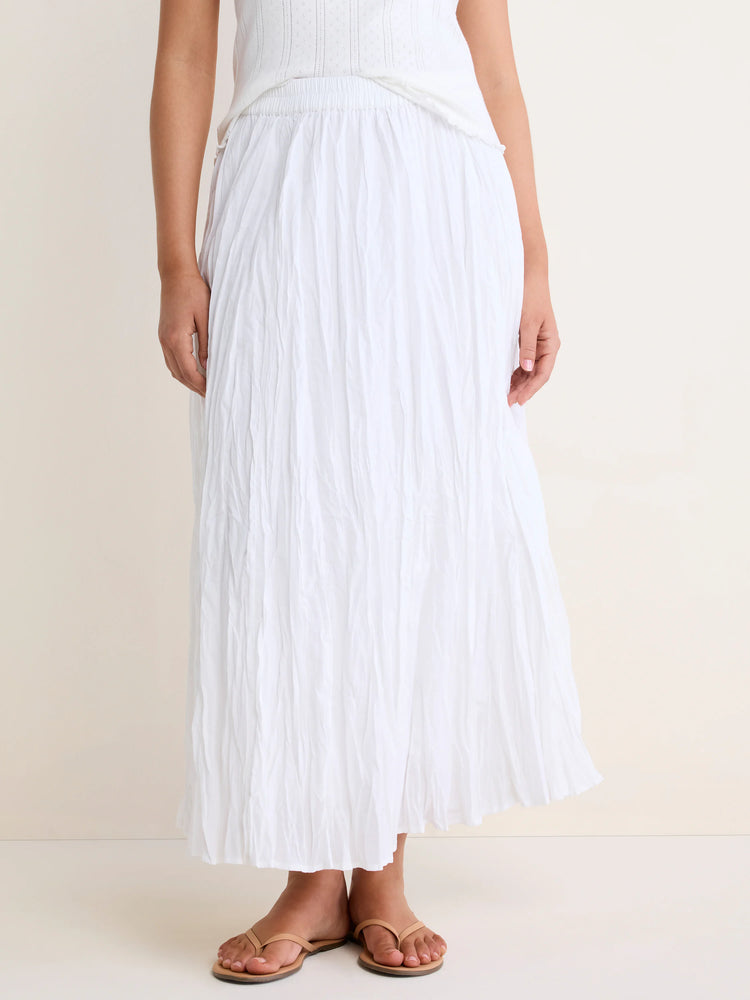 White, flowy crinkled skirt with an elastic waist, shown ankle-length on a model.