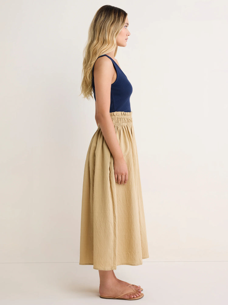 Mixed media dress: navy ribbed tank top, crinkled khaki smocked maxi skirt.