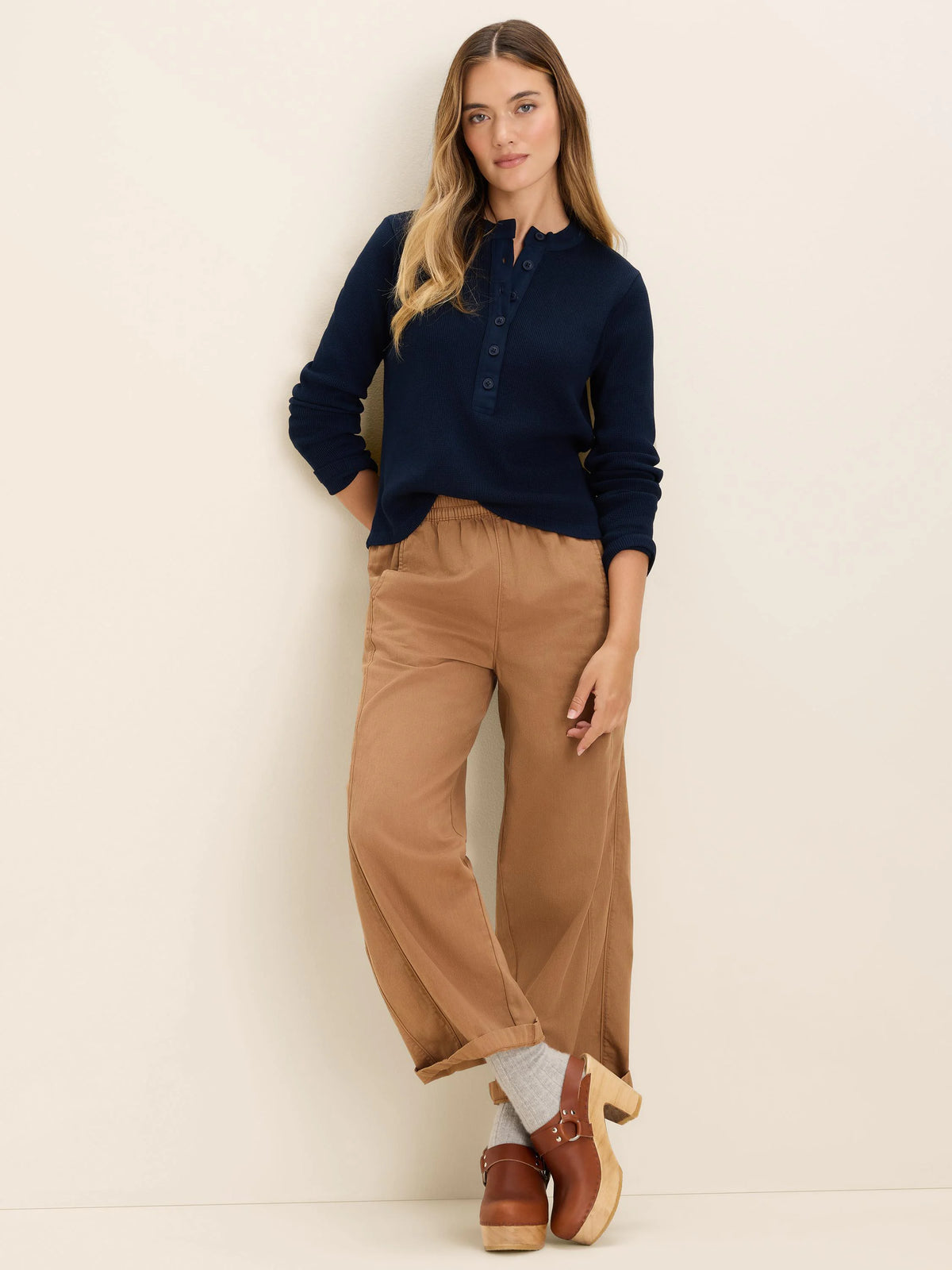 Navy blue long-sleeve thermal Henley top with a waffle knit texture and buttoned placket.
