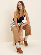 Navy ribbed tank top with delicate lace trim on the neckline.