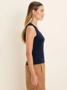 Navy blue ribbed tank top with dark lace trim on the V-neckline and shoulder straps.
