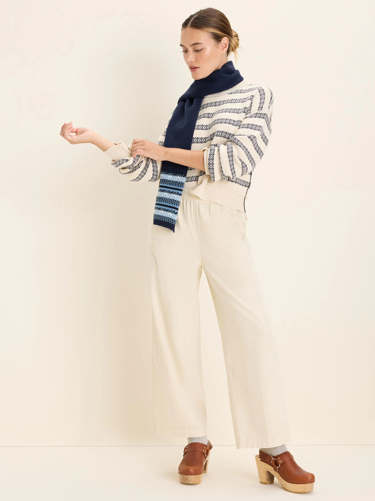 Cream jacquard sweater with navy geometric striped pattern. Features ribbed cuffs and hem.