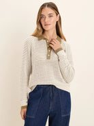 Cream mesh long sleeve polo sweater with olive green collar, button placket, and cuff stripes.