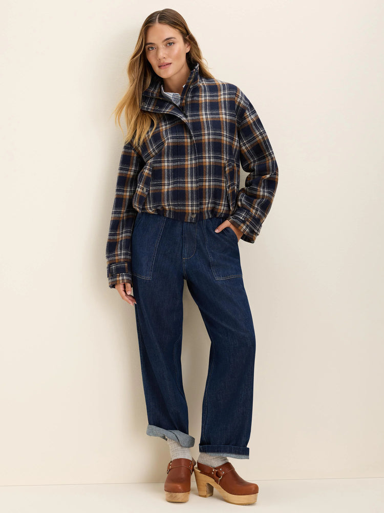 Dark blue, brown, and white plaid cropped jacket with a high collar and elasticized hem.