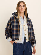 Navy, brown, & cream plaid jacket. Cropped fit, stand collar, & zip front.