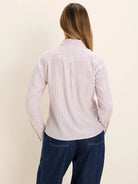 Off-white shirt with thin light pink and dark grey vertical stripes, shown from the back.