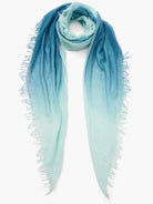 Dip-dye cashmere and silk scarf.  Ombre design transitioning from teal to light blue.  Frayed edges.