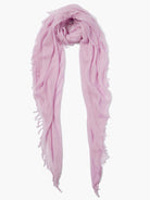 Light pink rectangular scarf with frayed edges.  Folded loosely.