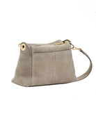 Bryant Medium: Light gray pebbled leather shoulder bag with soft, slouchy shape, gold-tone hardware, and top zipper.