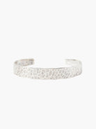 Silver hammered cuff bracelet; textured surface, slightly irregular shape.