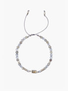Gray beaded bracelet with light blue crystals and a rectangular labradorite centerpiece.  Silver-toned accents and gray...