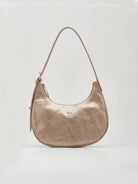 Shimmering taupe crescent shoulder bag with a single strap, gold-toned zipper, and embossed logo on front.