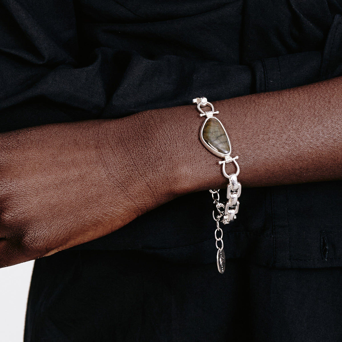Deep black woven fabric with a subtle texture and soft natural folds.