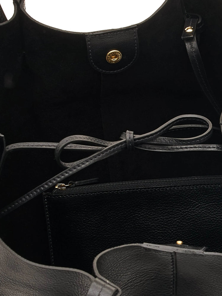 Black leather tote bag with gold-toned hardware; interior features a small zipped pocket and drawstring closure.