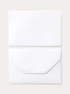 White card and envelope.  Small, light gray logo on envelope.  Subtle embossing.