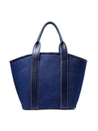Dark blue linen top handle bag with navy leather handles and vertical trim.