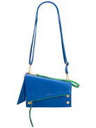 Blue pebbled leather crossbody bag with an angled green zipper and pulls, gold hardware, and a thin blue strap.