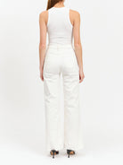 Off-white, wide-leg jeans with frayed hems.  Back view shows two back pockets.
