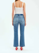Here's alt text for the image, keeping it concise and focusing on visual details:

"Back view of light-wash, straight-leg...