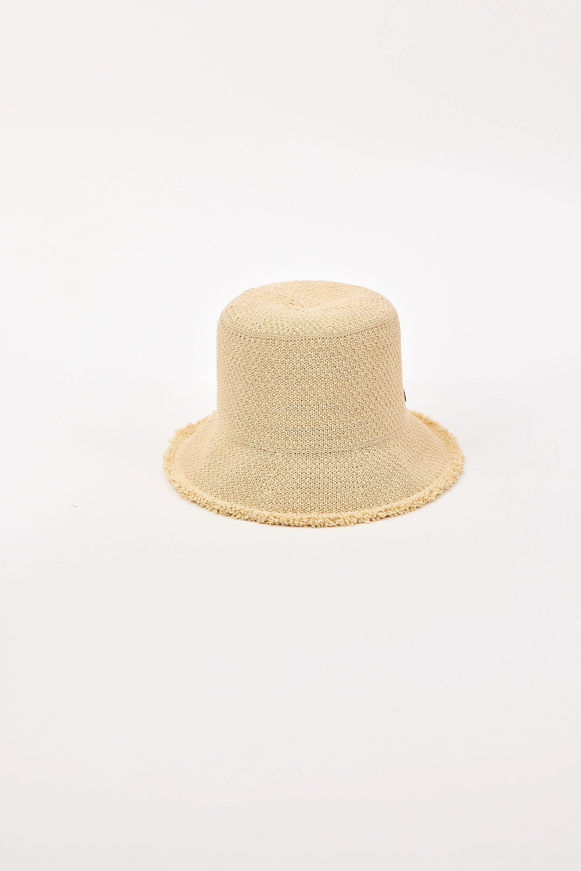 Light beige woven bucket hat with a round crown and a soft, frayed brim.