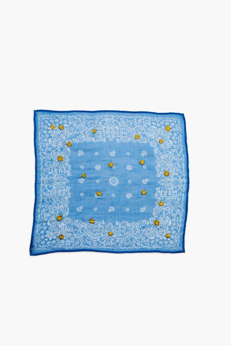 Light blue bandana with white paisley print border, scattered gold embroidered flowers, and a dark blue edge.