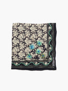 Dark navy bandana with light grey floral print. Features embroidered blue/green flowers & a light green wavy border.