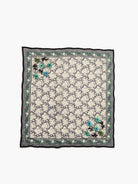 Square charcoal bandana with off-white floral print. Green beaded vine border, raised blue/green embroidered flowers.