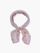 Lavender bandana with orange and white floral embroidery.