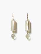 Gold hook earrings with iridescent white mother-of-pearl cylinders and pale green faceted teardrop gems.