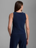 Navy high neck tank, back view. Sleeveless, smooth knit fabric.