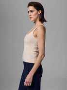 Light beige tank top with scoop neck and visible vertical corset-style seams on a model.
