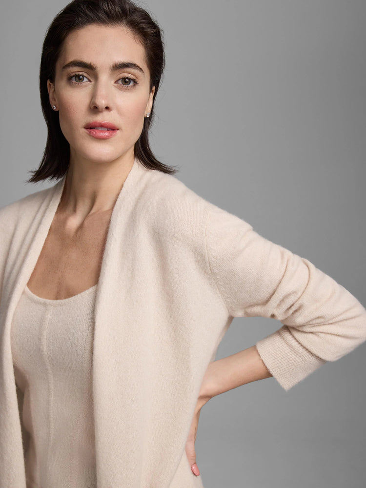 Pale beige cashmere tank with scoop neck and subtle ribbed "corset" side details.