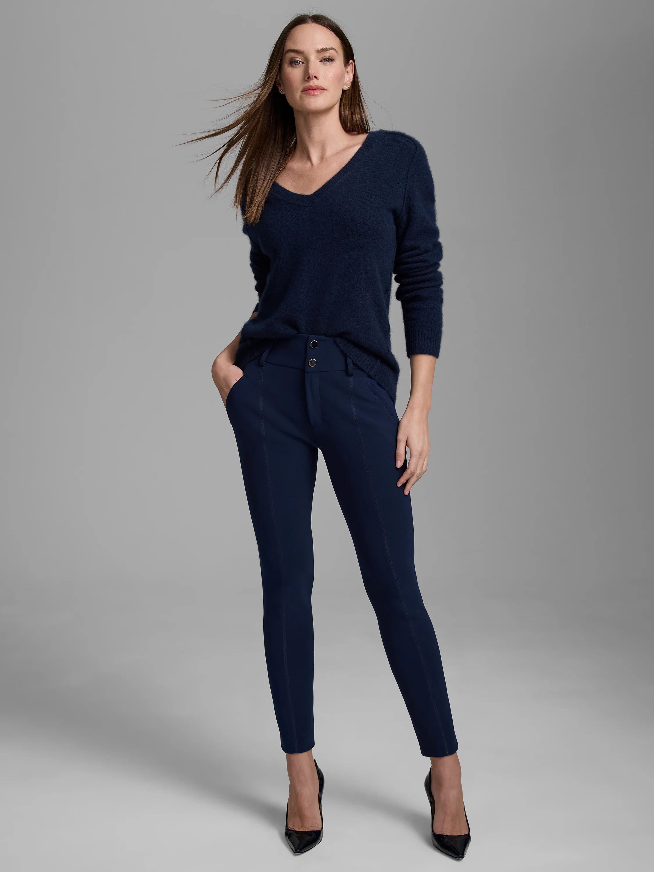 Navy blue V-neck sweater with a soft, fuzzy texture.