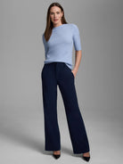 Pale blue cashmere mock neck sweater with short sleeves.