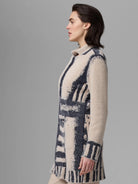 Textured cream knit jacket with an abstract pattern of irregular navy blue stripes and blocks.