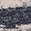 Dark gray, possibly charcoal.  Appears slightly textured, possibly knit or woven.  Poor image res...