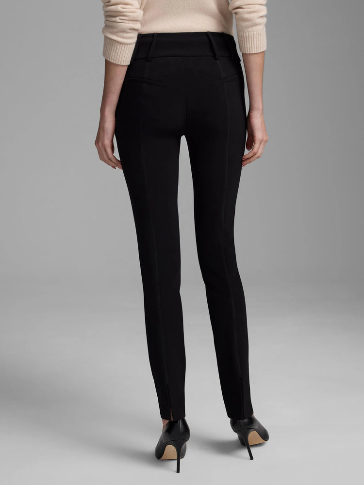 Black knit scuba slim pants, rear view. Features vertical leg seams, waistband details, and small ankle slits.