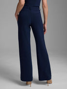 Rear view of dark navy wide-leg trousers, high-waisted with belt loops and subtle back pockets.