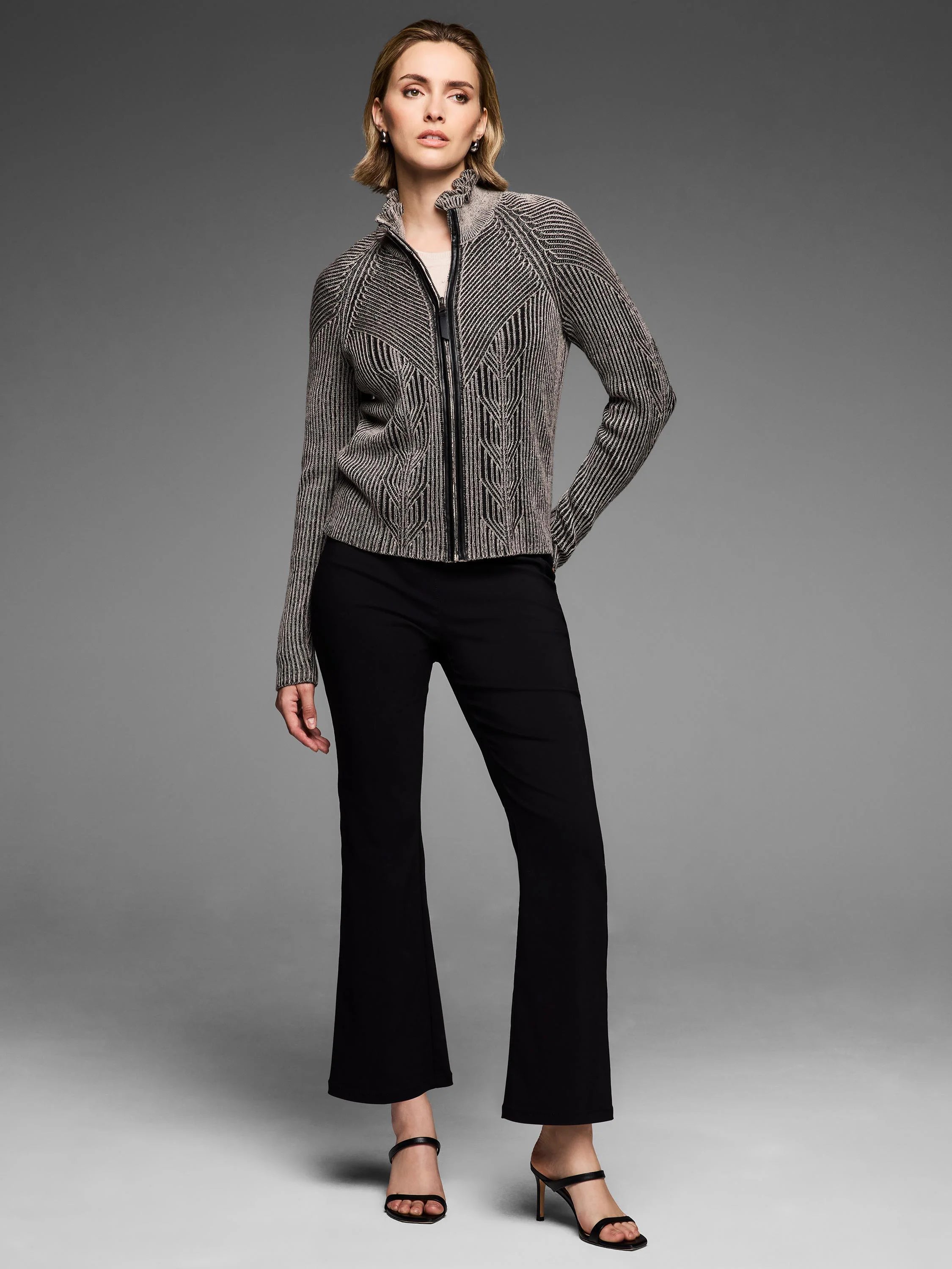 Black and beige zip cardigan, engineered knit with vertical stripes, a vine pattern, and a stand collar.