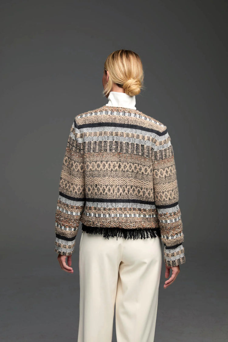 Beige knit jacket, black & white striped & geometric patterns, black fringe hem.