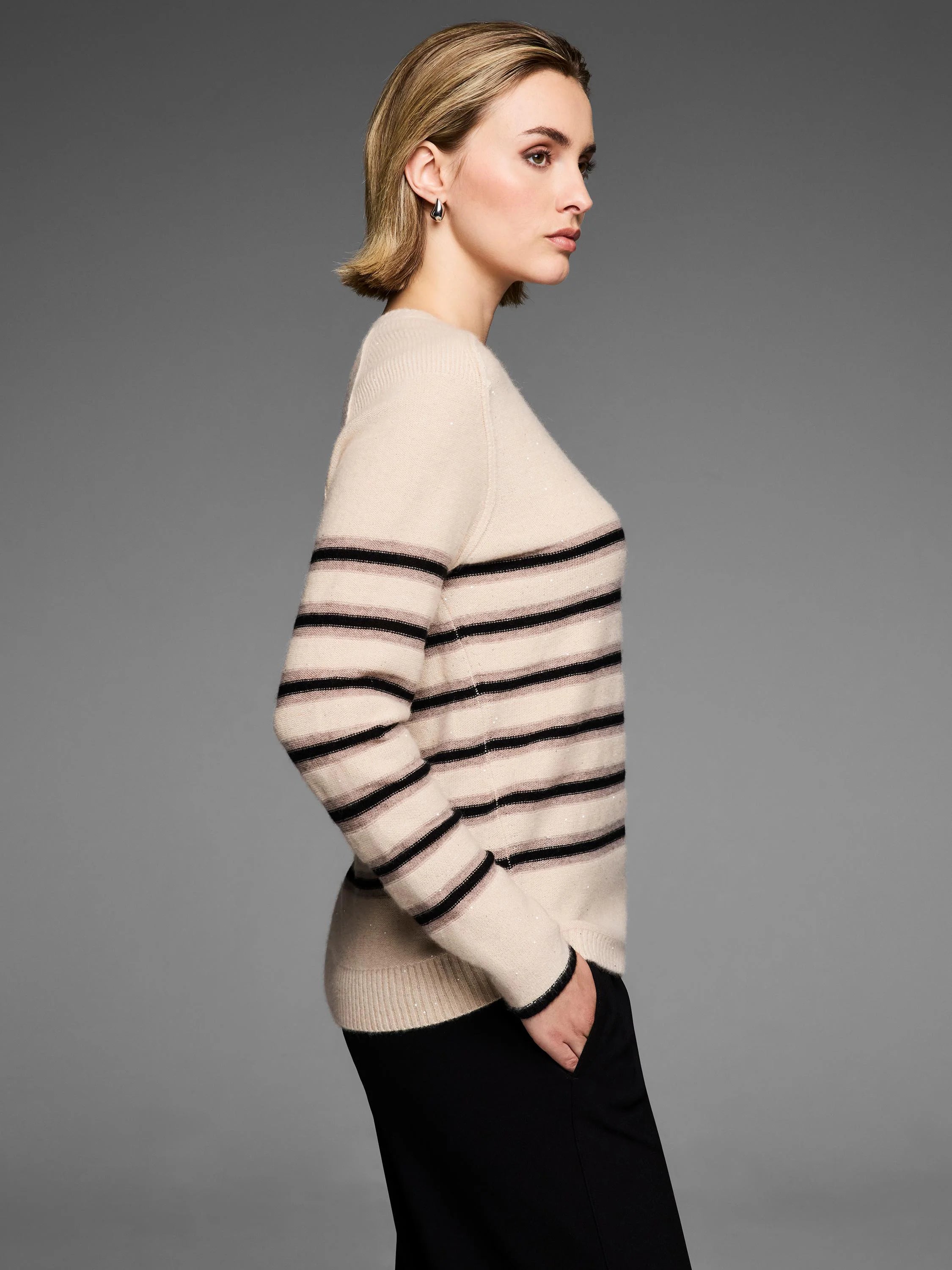 Cream sparkle sweater with horizontal black and light brown stripes.