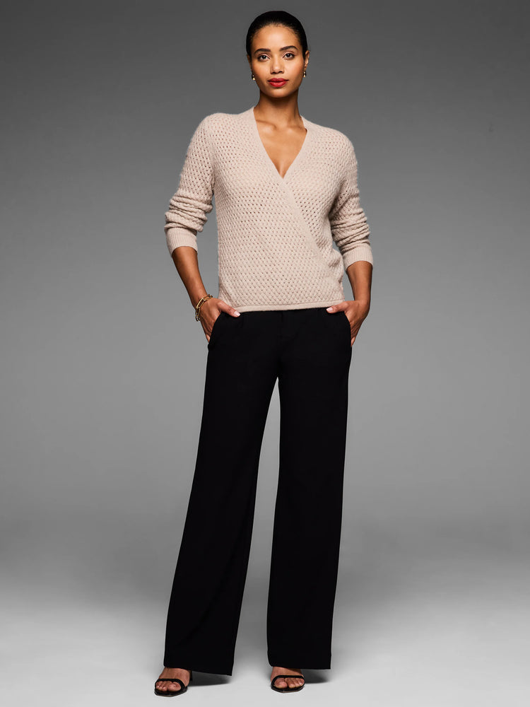 Light beige pointelle knit wrap cardigan, styled with a deep V-neck.